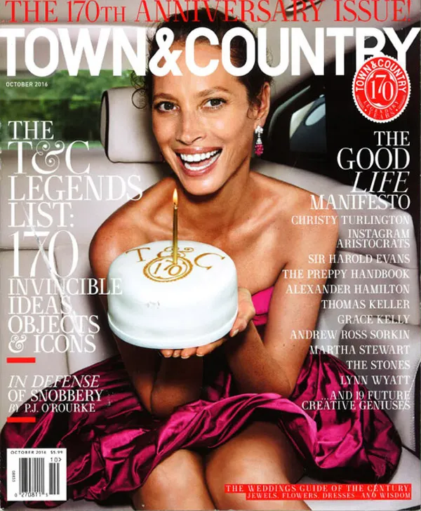 Town & Country cover: smiling woman holding a cake.